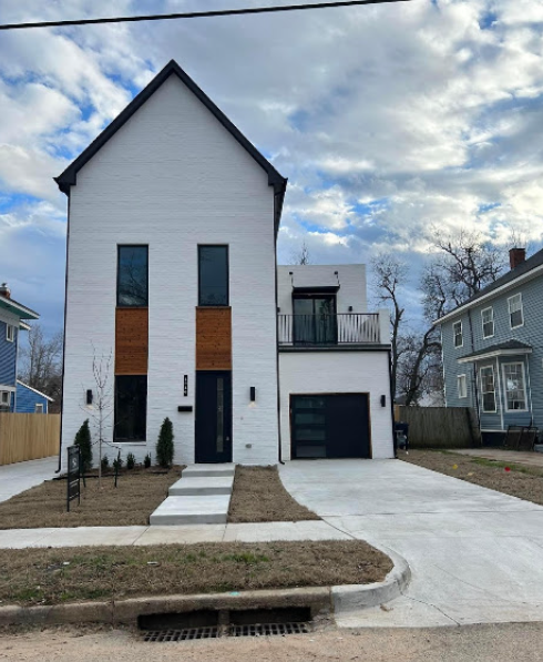 White painted brick modern farmhouse exterior with cedar accents